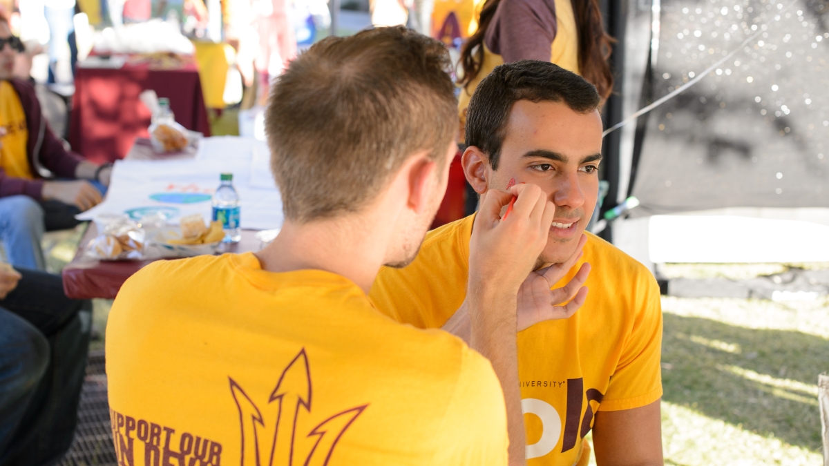 student getting face painted