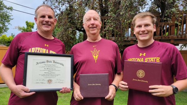 Eric Povilus (left), William Povilus (center) and Blake Povilus (right) pose for a photo with their diplomas from Arizona State University.