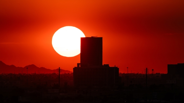 Sunset and red sky behind the skyline of Phoenix