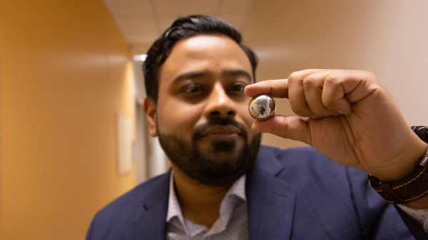 ASU Assistant Professor Kumar Ankit holds a steel ball bearing.